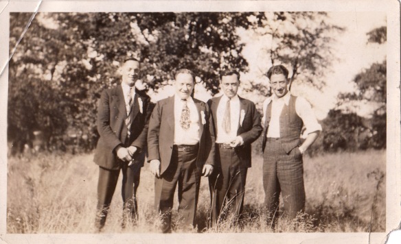 Hyman (second from left) and Joe (far right) and two unknown men
